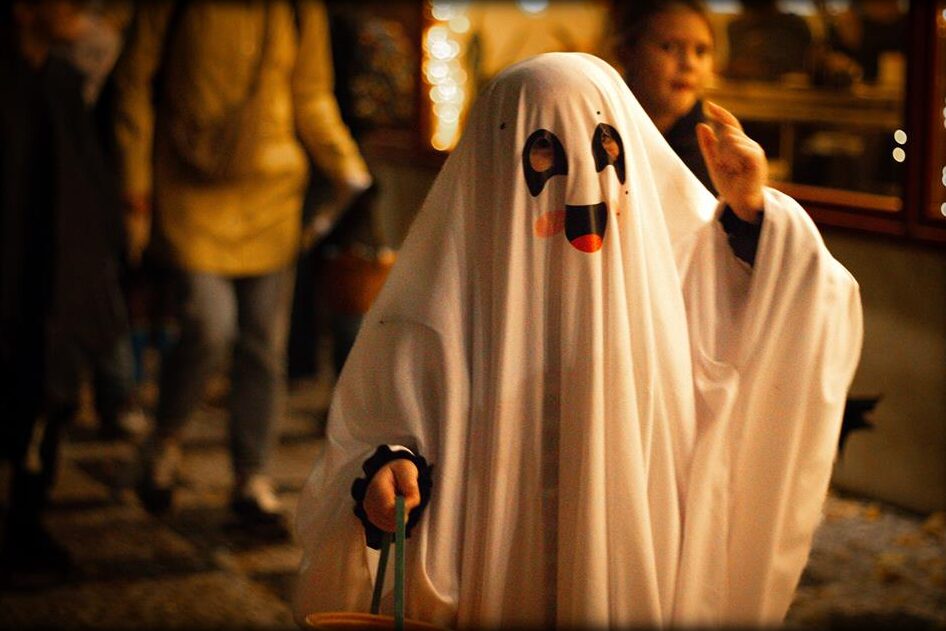 A classic white ghost costume at night